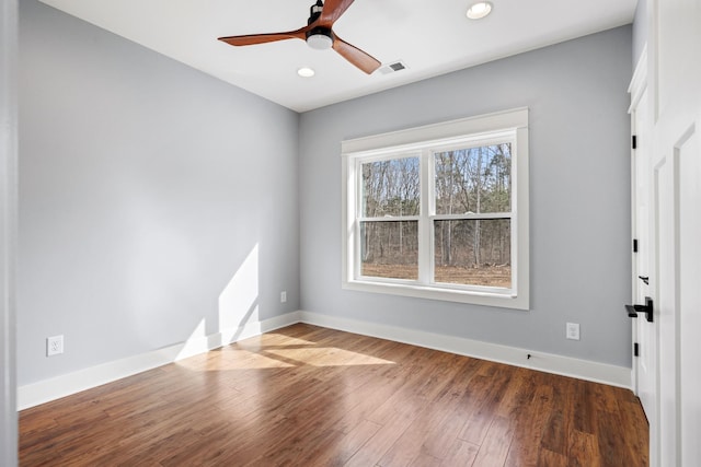 spare room with recessed lighting, visible vents, ceiling fan, wood finished floors, and baseboards