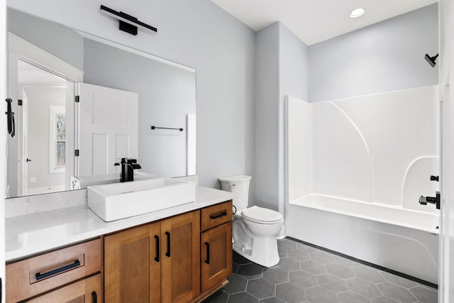 bathroom featuring bathtub / shower combination, toilet, recessed lighting, vanity, and tile patterned floors