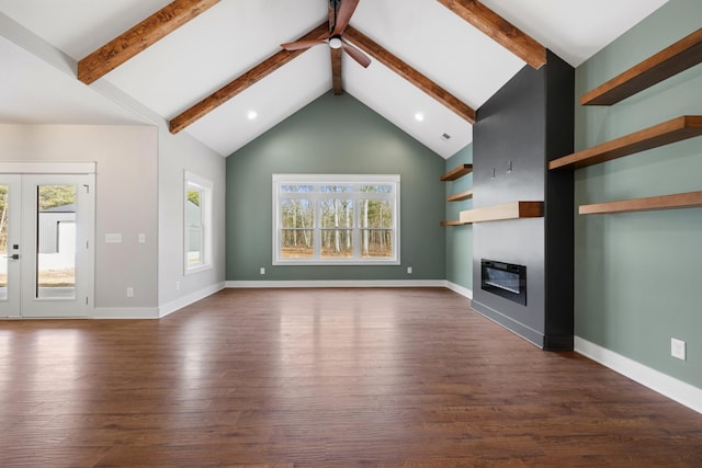 unfurnished living room featuring baseboards, a ceiling fan, dark wood-type flooring, and a glass covered fireplace