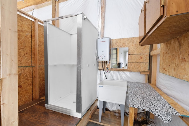 interior space with a shower stall and wood finished floors