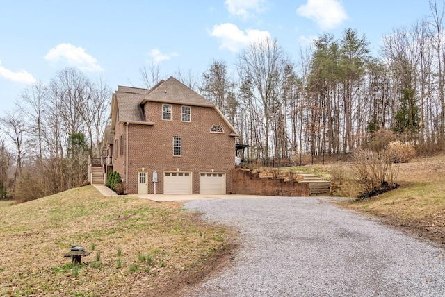 view of side of home with a garage