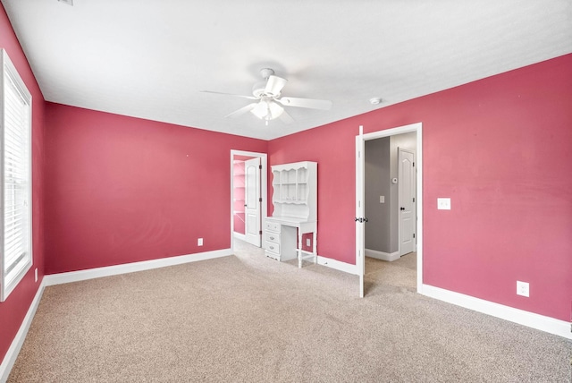 unfurnished bedroom featuring carpet flooring and ceiling fan