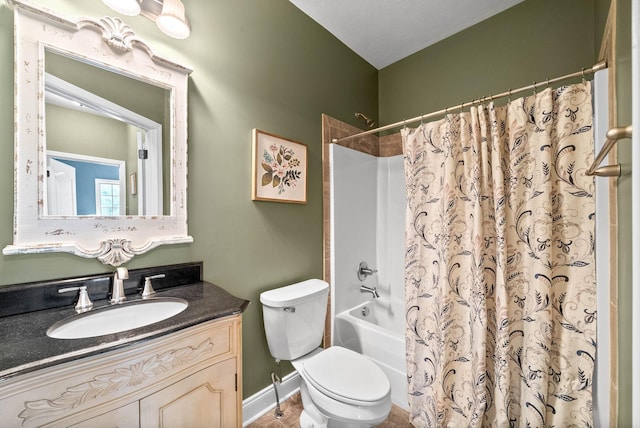 full bathroom with vanity, toilet, and shower / tub combo with curtain