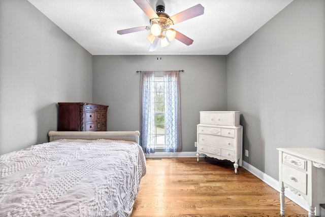 bedroom featuring wood-type flooring and ceiling fan