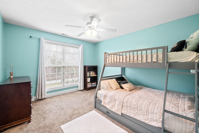 bedroom with light carpet and ceiling fan