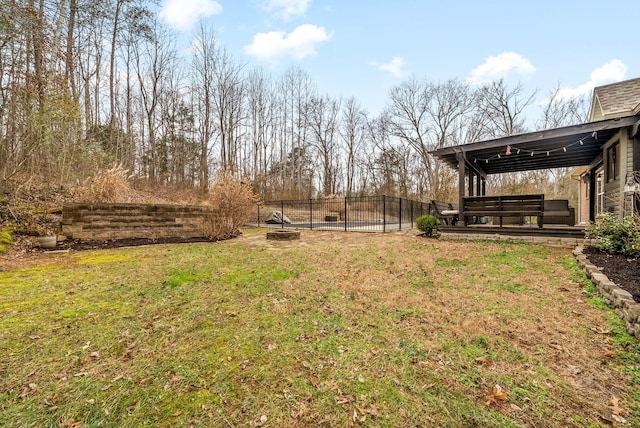 view of yard featuring an outdoor fire pit