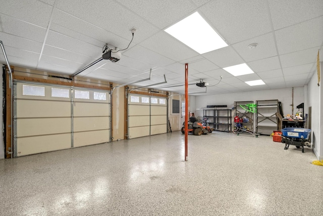 garage featuring a garage door opener and electric panel