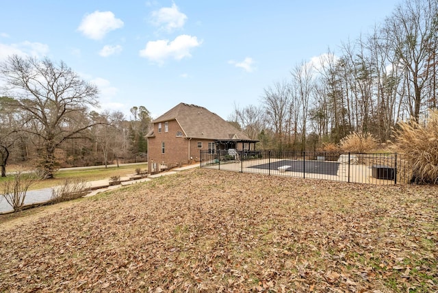 view of yard featuring a covered pool and a patio