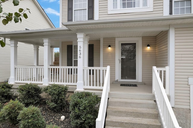 doorway to property featuring a porch