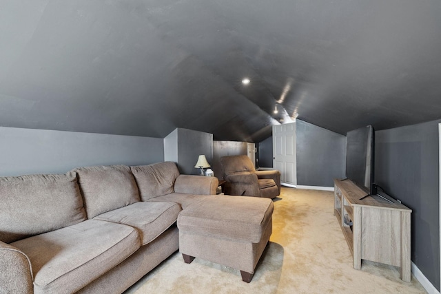 cinema featuring lofted ceiling, baseboards, and light colored carpet