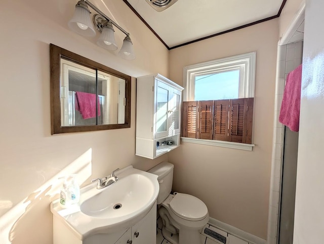 bathroom featuring toilet, vanity, and crown molding