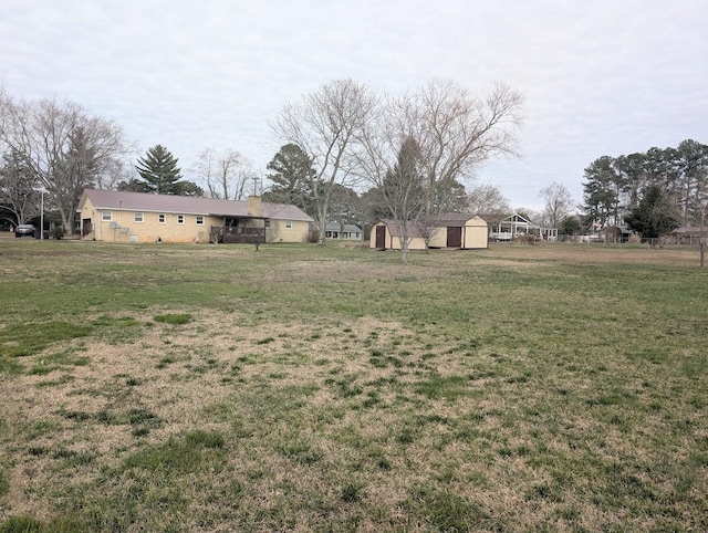 view of yard with a storage shed