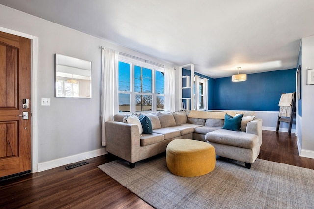 living room with dark hardwood / wood-style floors