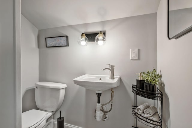 bathroom featuring sink and toilet