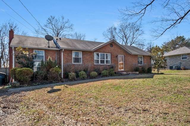 ranch-style home with a front lawn