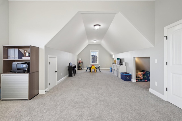 game room featuring vaulted ceiling and light colored carpet