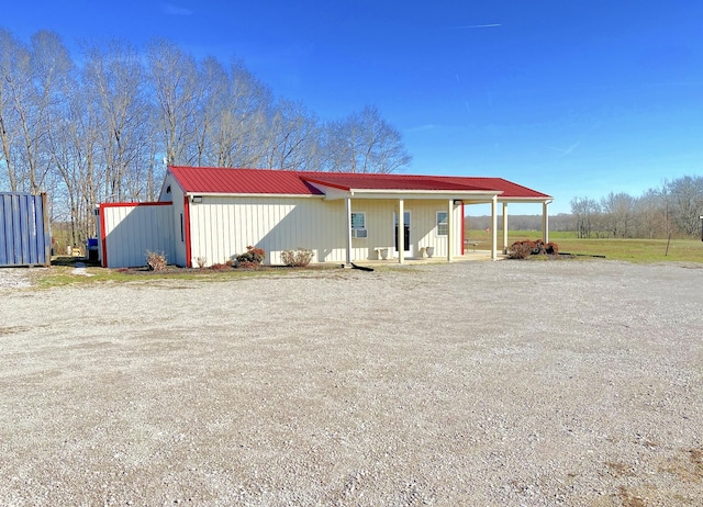 view of outdoor structure featuring covered porch