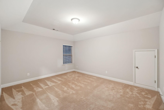 unfurnished room with light colored carpet