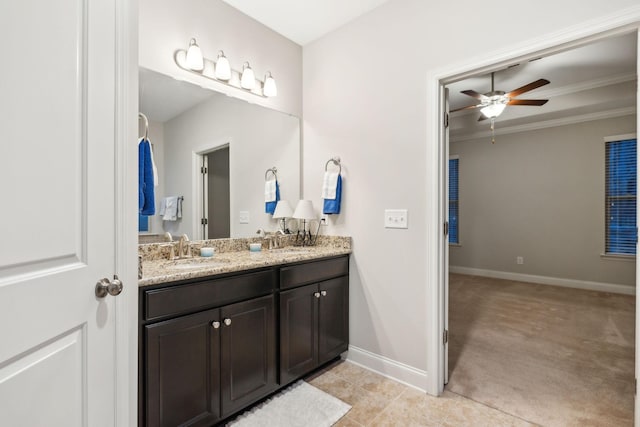 bathroom featuring ceiling fan, vanity, and crown molding