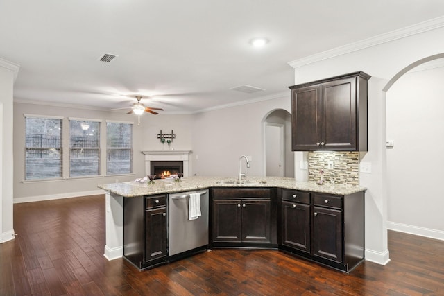 kitchen with dark brown cabinets, dishwasher, dark wood-type flooring, light stone counters, and sink