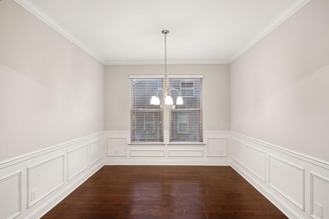 unfurnished dining area with a notable chandelier, ornamental molding, and dark hardwood / wood-style flooring