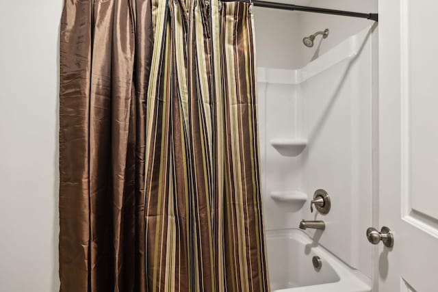 bathroom with shower / tub combo with curtain