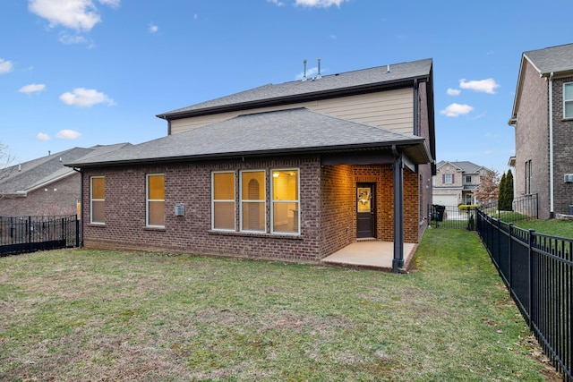 back of property with a patio and a lawn