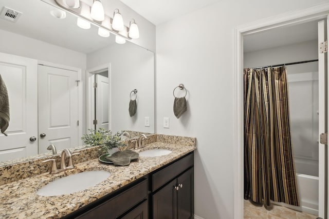 bathroom with shower / bathtub combination with curtain and vanity