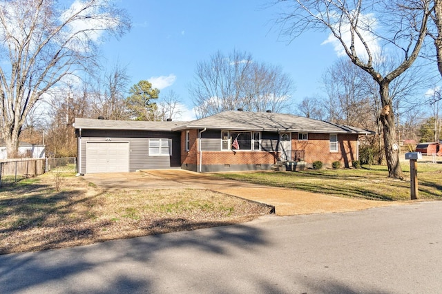 ranch-style home featuring a garage and a front lawn