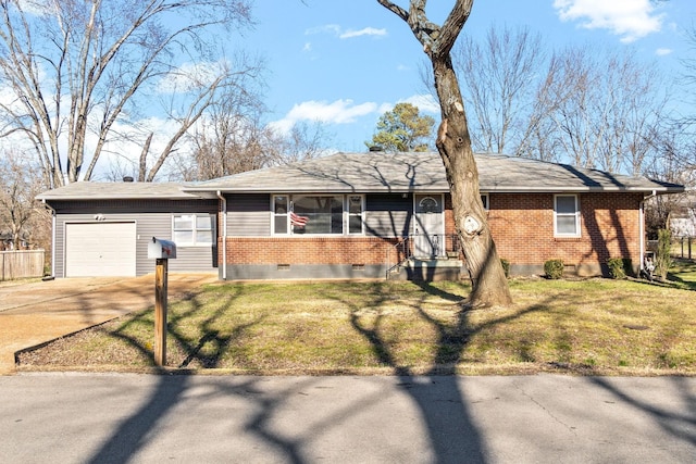 ranch-style house featuring a garage and a front lawn