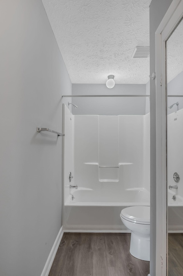 214 Cedarwood Ln Unit 214, Madison, TN 37115 - full bath with wood finished floors, tub / shower combination, and a textured ceiling