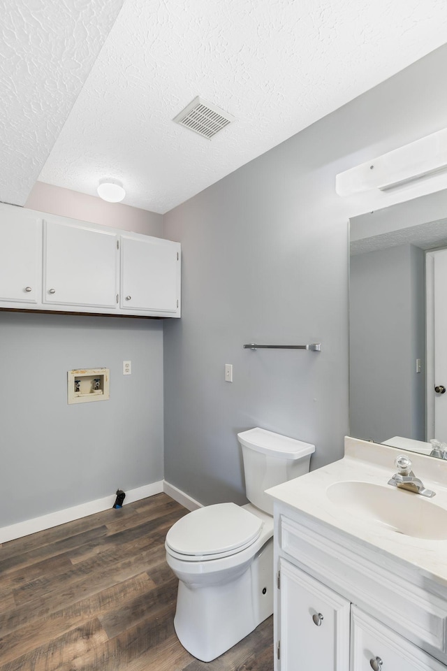 214 Cedarwood Ln Unit 214, Madison, TN 37115 - half bath with vanity, a textured ceiling, and wood finished floors
