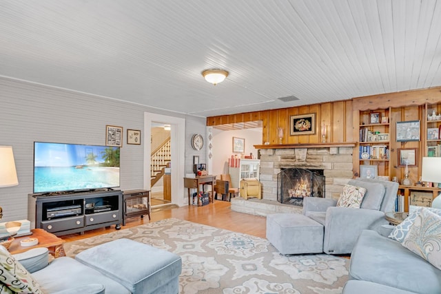 2360 Seven Mile Ferry Rd, Clarksville, TN 37040 - living room with a stone fireplace and light hardwood / wood-style flooring