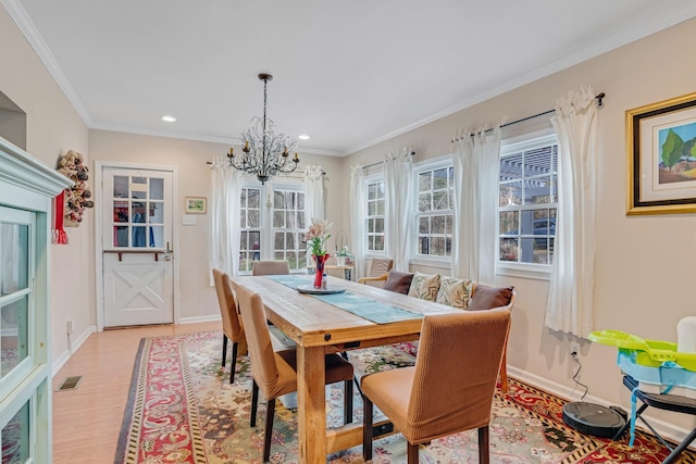2360 Seven Mile Ferry Rd, Clarksville, TN 37040 - dining room with an inviting chandelier, light hardwood / wood-style flooring, and ornamental molding