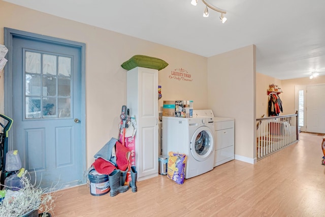 2360 Seven Mile Ferry Rd, Clarksville, TN 37040 - washroom featuring washer and clothes dryer and light hardwood / wood-style flooring