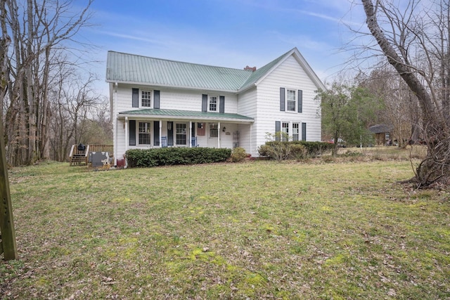 view of front property featuring a front lawn and a porch