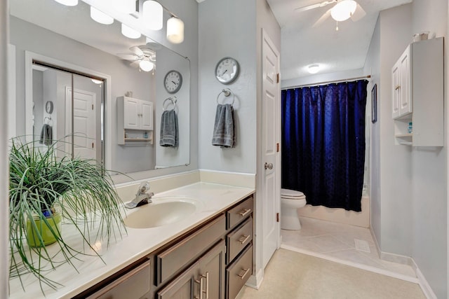 full bathroom featuring shower / tub combo with curtain, toilet, vanity, ceiling fan, and tile patterned flooring