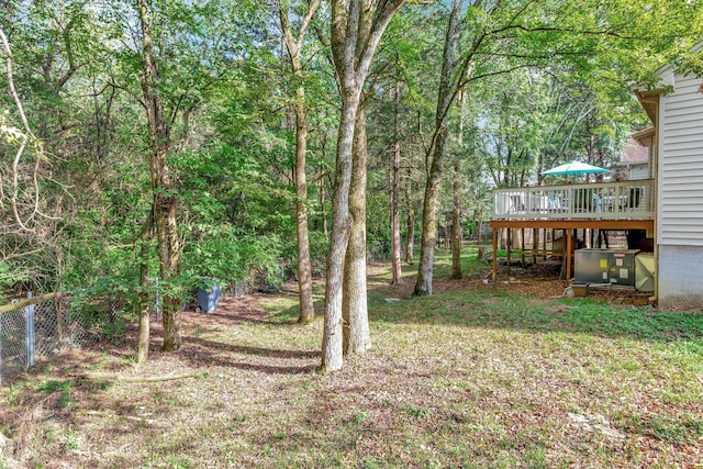 view of yard featuring a wooden deck