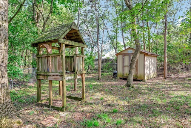 view of play area with a storage unit