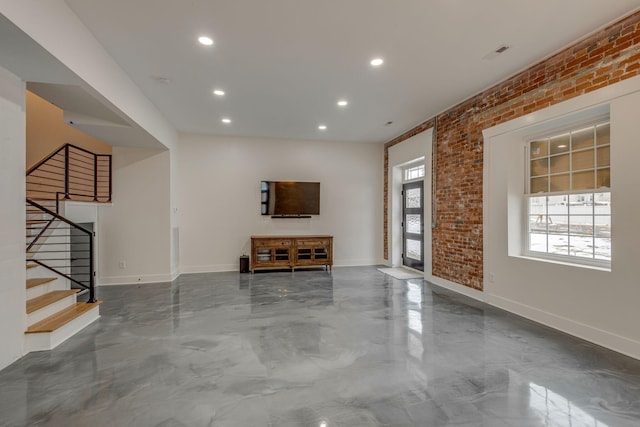 foyer entrance with brick wall