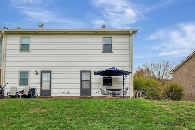 back of house with a yard