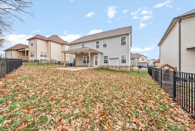 back of house with a patio and ceiling fan