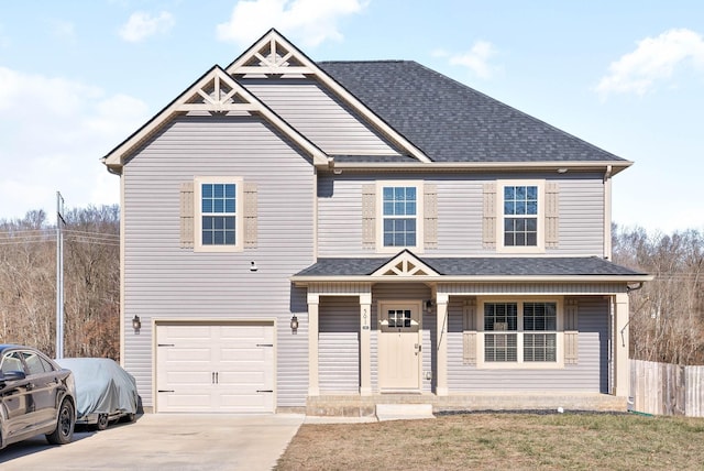 view of front of house with covered porch and a garage