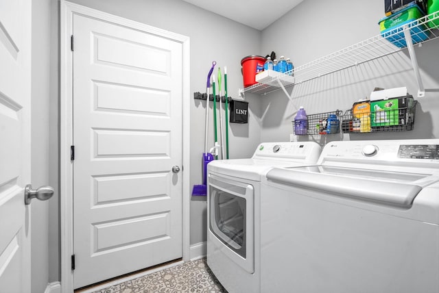 washroom with independent washer and dryer