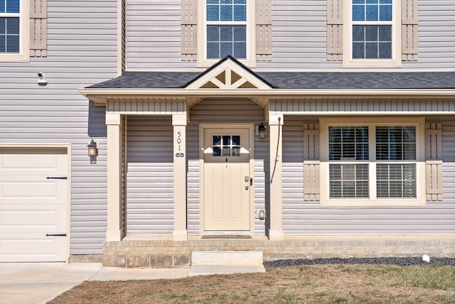 property entrance with a garage