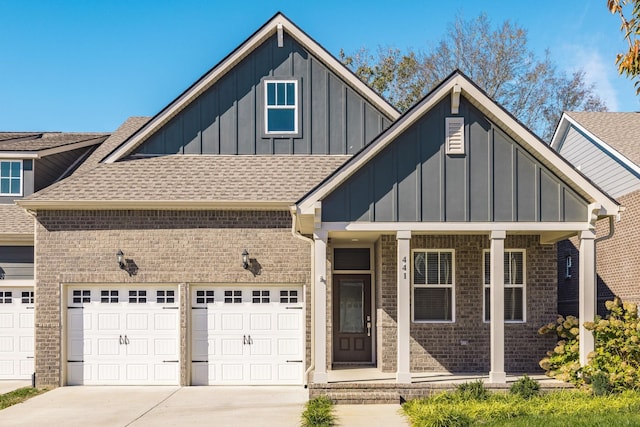 view of front of house featuring covered porch and a garage