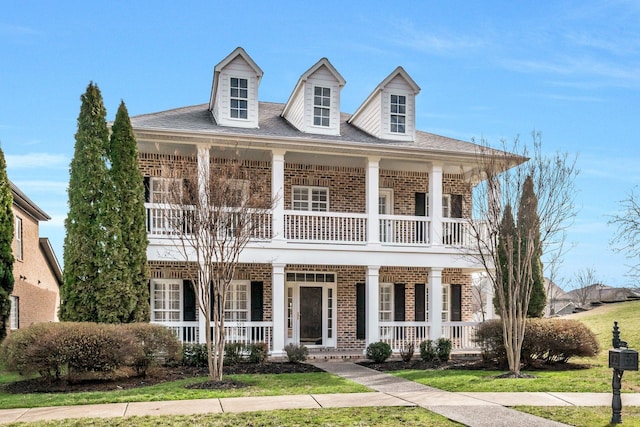 cape cod house featuring a porch