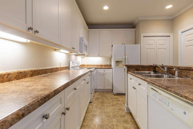 kitchen featuring sink, white appliances, crown molding, and white cabinets