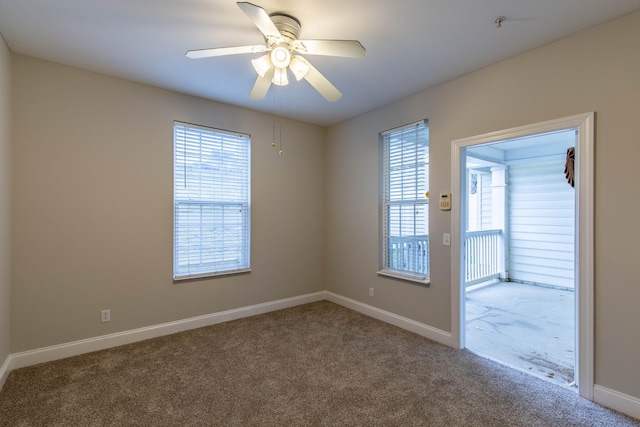 empty room with ceiling fan and carpet