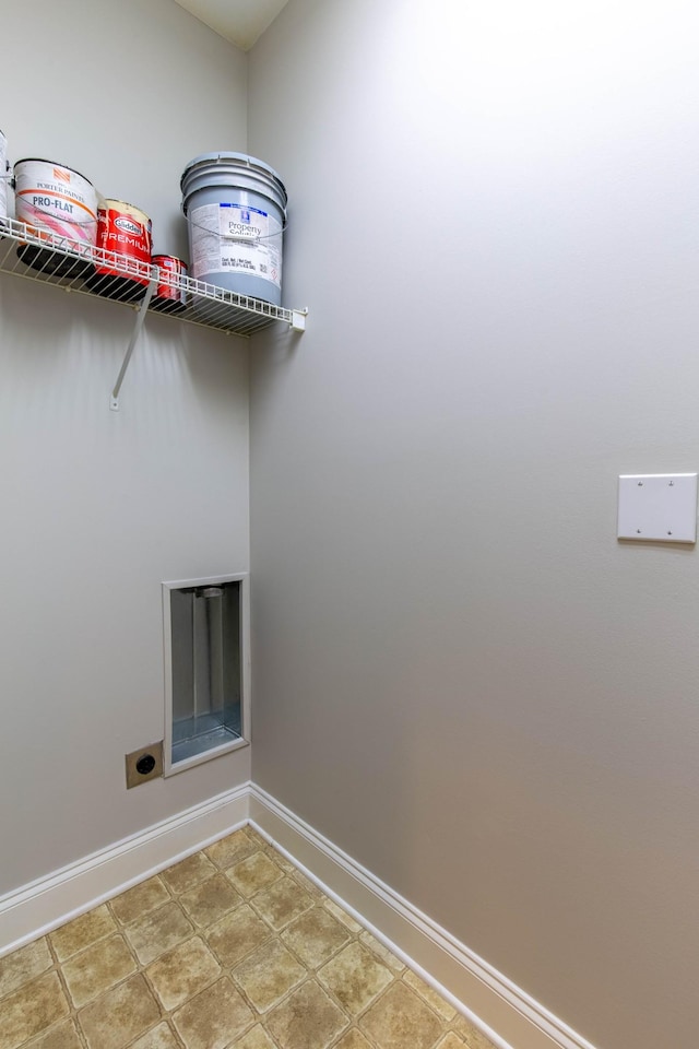 clothes washing area featuring hookup for an electric dryer